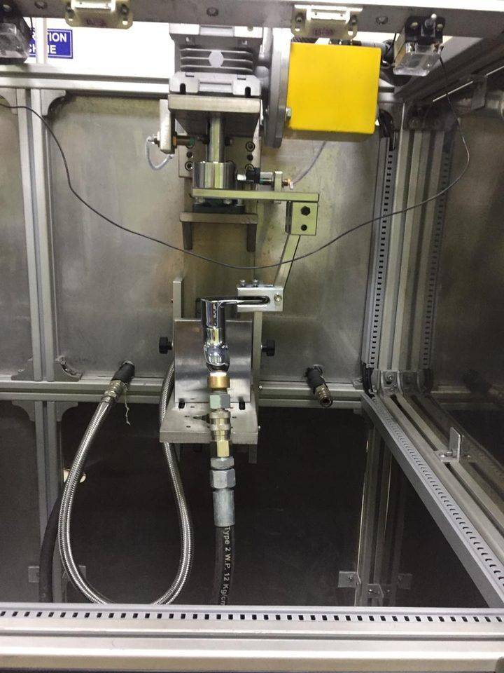 Faucet leak testing machine with jig clamping and high pressure test