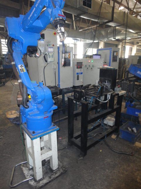 OTC Daihen articulated robot MIG welding cell in production